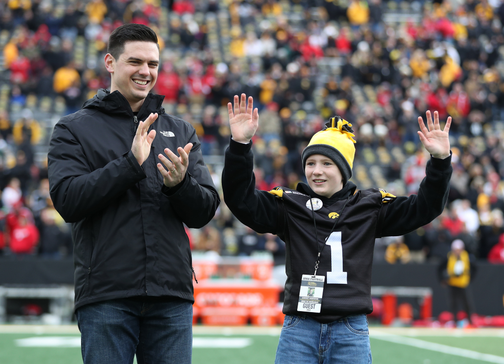Honorary captain James Morris and Stead Family Children's Hospital Kid Captain Garret Schuster before their game against the Nebraska Cornhuskers Friday, November 23, 2018 at Kinnick Stadium. (Brian Ray/hawkeyesports.com)