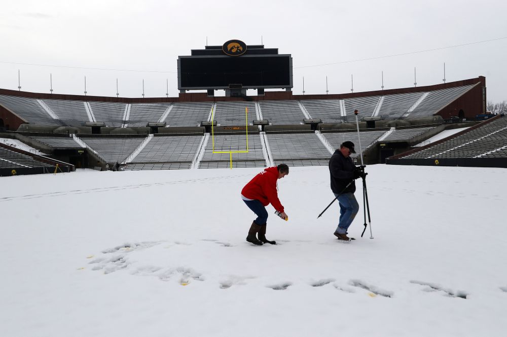 Members of the Iowa Athletics Turf Management staff create the #SnowWave for kids in the Stead Family Children's Hospital Thursday, February