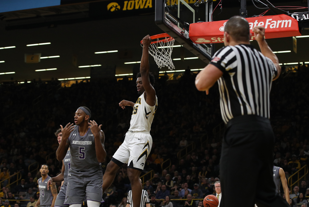 Iowa Hawkeyes forward Tyler Cook (25) gets the dunk and foul against the Northwestern Wildcats Sunday, February 10, 2019 at Carver-Hawkeye Arena. (Brian Ray/hawkeyesports.com)
