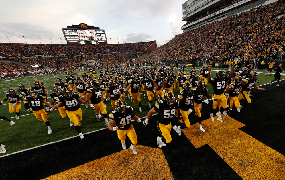 The Iowa Hawkeyes run to get the Cy-Hawk trophy following their game against the Iowa State Cyclones Saturday, September 8, 2018 at Kinnick Stadium. (Brian Ray/hawkeyesports.com)