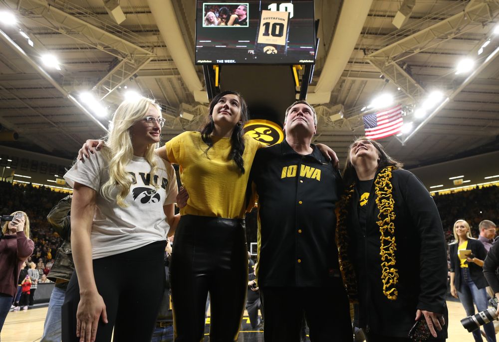 Megan Gustafson stands with her family as her number is raised into the rafters during a jersey retirement ceremony Sunday, January 26, 2020 at Carver-Hawkeye Arena. (Brian Ray/hawkeyesports.com)