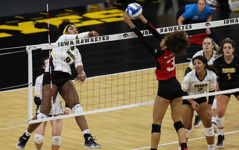 Iowa Hawkeyes middle blocker Amiya Jones (9) spikes the ball during a match against Rutgers at Carver-Hawkeye Arena on November 2, 2018. (Tork Mason/hawkeyesports.com)