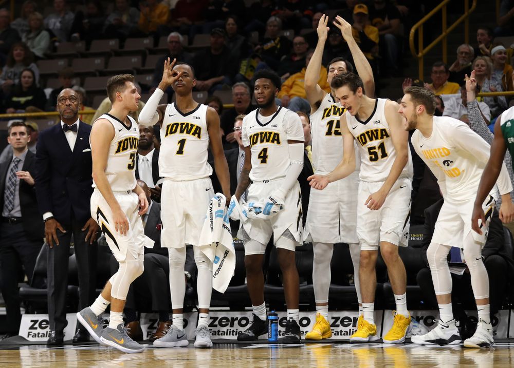 Iowa Hawkeyes guard Jordan Bohannon (3) knocks down a three point basket as guard Maishe Dailey (1) and forward Nicholas Baer (51) celebrate against UW Green Bay Sunday, November 11, 2018 at Carver-Hawkeye Arena. (Brian Ray/hawkeyesports.com)