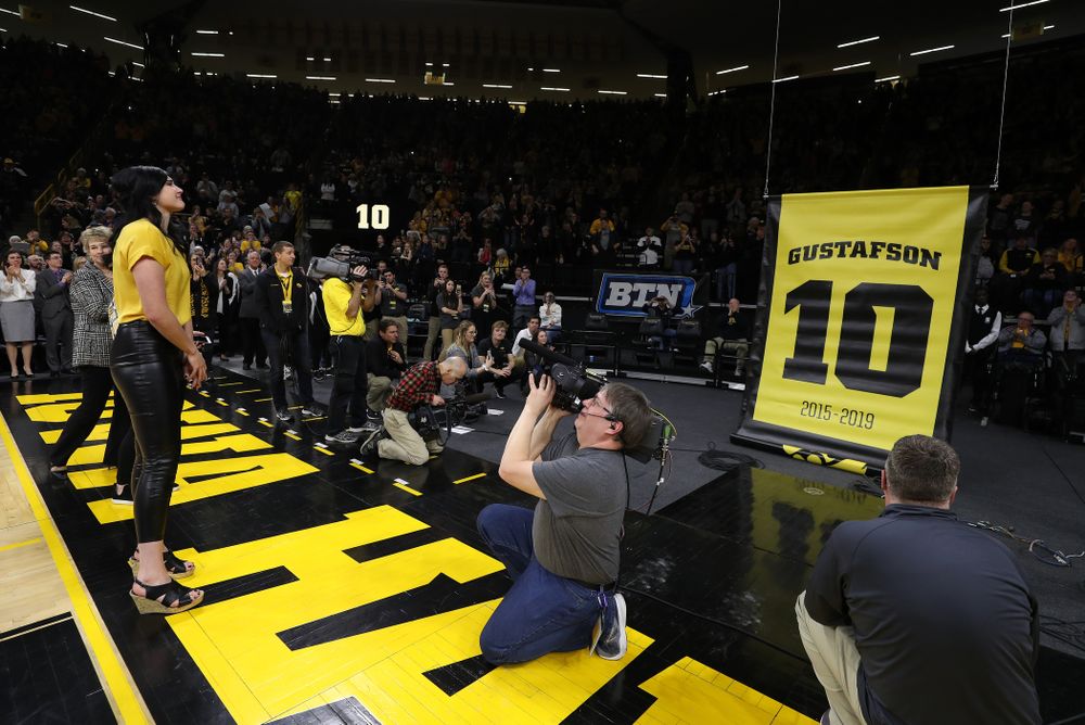 Megan Gustafson stands with her family as her number is raised into the rafters during a jersey retirement ceremony Sunday, January 26, 2020 at Carver-Hawkeye Arena. (Brian Ray/hawkeyesports.com)