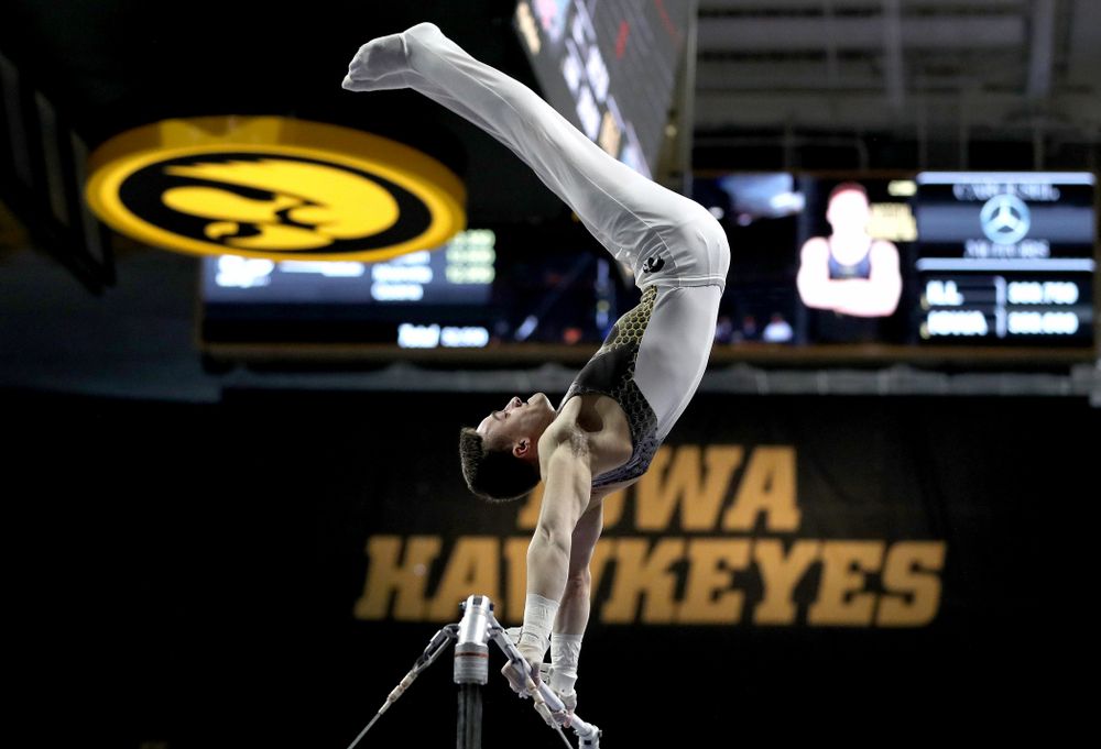 Iowa’s Mitch Mandozzi competes on the high bar against Illinois Sunday, March 1, 2020 at Carver-Hawkeye Arena. (Brian Ray/hawkeyesports.com)