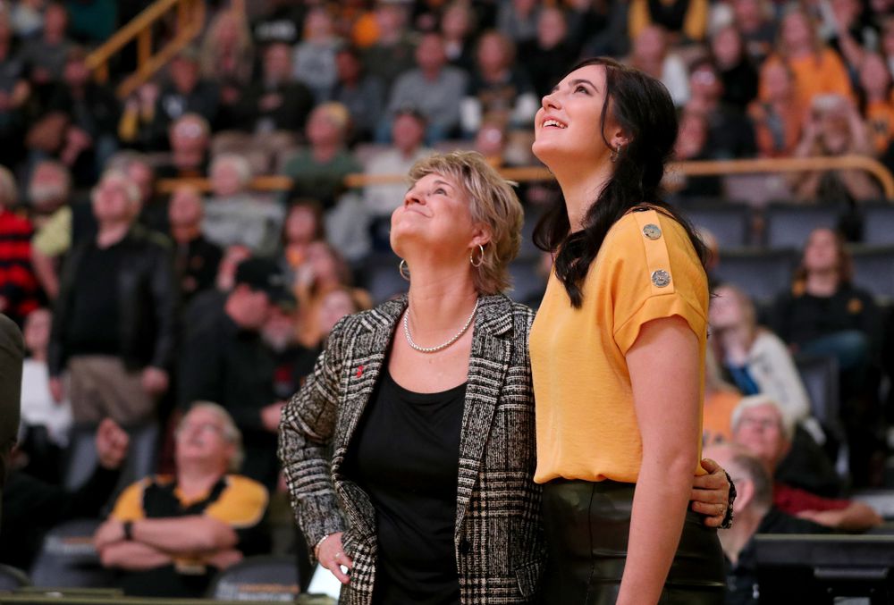 Megan Gustafson watches a video with head coach Lisa Bluder during a jersey retirement ceremony Sunday, January 26, 2020 at Carver-Hawkeye Arena. (Brian Ray/hawkeyesports.com)