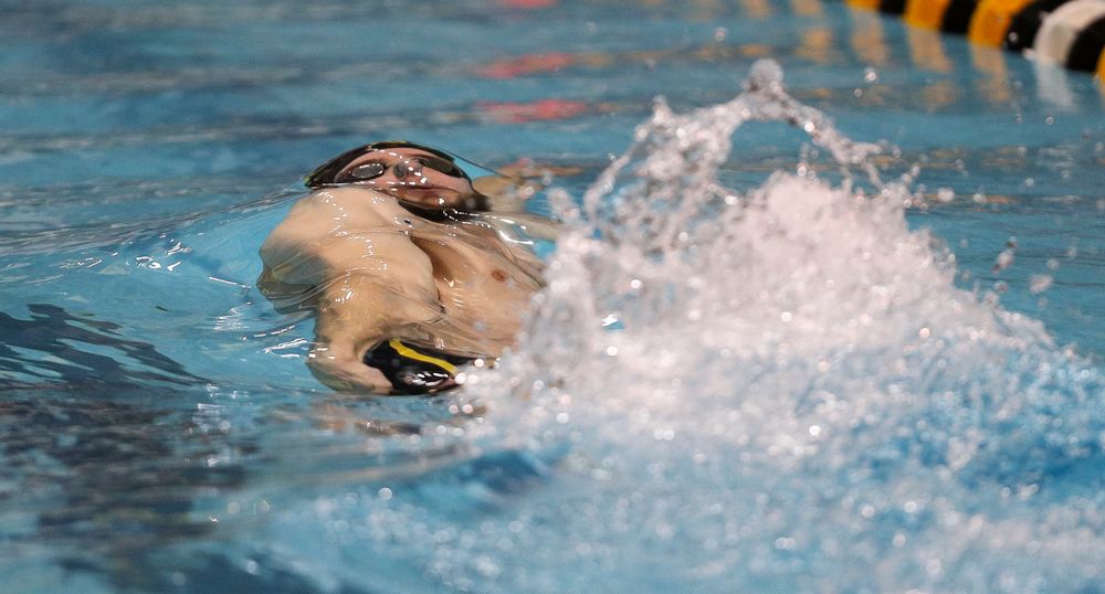 Iowa's Kenneth Mende competes in the 100-yard backstroke during the third day of the Hawkeye Invitational at the Campus Recreation and Wellness Center on November 16, 2018. (Tork Mason/hawkeyesports.com)