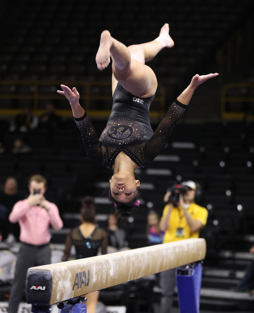 Iowa's Lauren Guerin competes on the bars during their meet against the Minnesota Golden Gophers Saturday, January 19, 2019 at Carver-Hawkeye Arena. (Brian Ray/hawkeyesports.com)