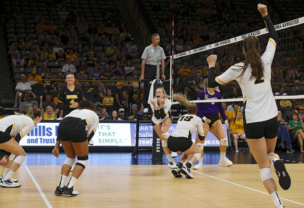 Iowa’s Meghan Buzzerio (5), Halle Johnston (4), Brie Orr (7), Kyndra Hansen (8), Hannah Clayton (18) and Courtney Buzzerio (2) celebrate a score during their Big Ten/Pac-12 Challenge match at Carver-Hawkeye Arena in Iowa City on Saturday, Sep 7, 2019. (Stephen Mally/hawkeyesports.com)