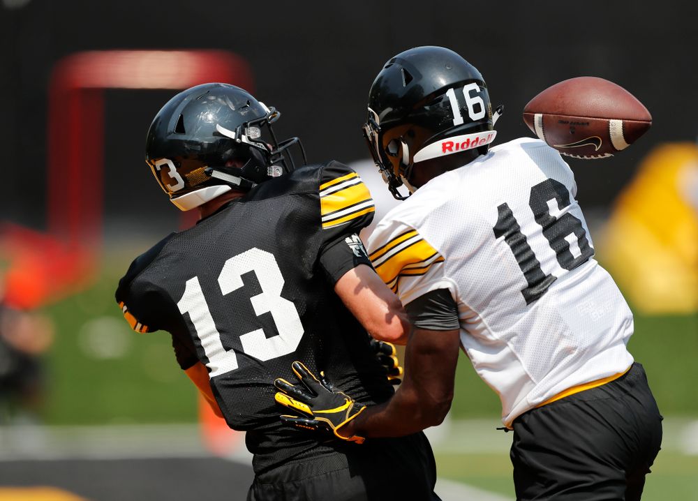 Iowa Hawkeyes defensive back Terry Roberts (16) and wide receiver Henry Marchese (13) during fall camp practice No. 9 Friday, August 10, 2018 at the Kenyon Practice Facility. (Brian Ray/hawkeyesports.com)