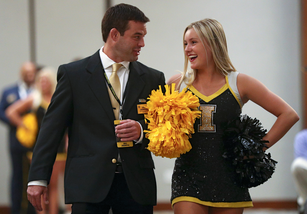 2019 University of Iowa Athletics Hall of Fame inductee Eric Juergens walks to his seat with a Spirit Squad member during the Hall of Fame Induction Ceremony at the Coralville Marriott Hotel and Conference Center in Coralville on Friday, Aug 30, 2019. (Stephen Mally/hawkeyesports.com)