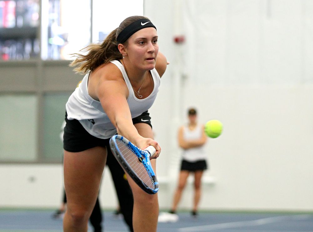 Iowa’s Ashleigh Jacobs returns a shot during her doubles match at the Hawkeye Tennis and Recreation Complex in Iowa City on Sunday, February 23, 2020. (Stephen Mally/hawkeyesports.com)