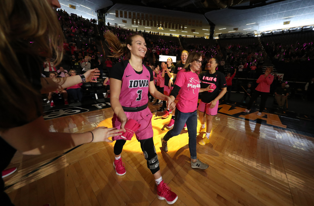 Iowa Hawkeyes guard Makenzie Meyer (3) is introduced with a cancer survivor before their game against the seventh ranked Maryland Terrapins Sunday, February 17, 2019 at Carver-Hawkeye Arena. (Brian Ray/hawkeyesports.com)