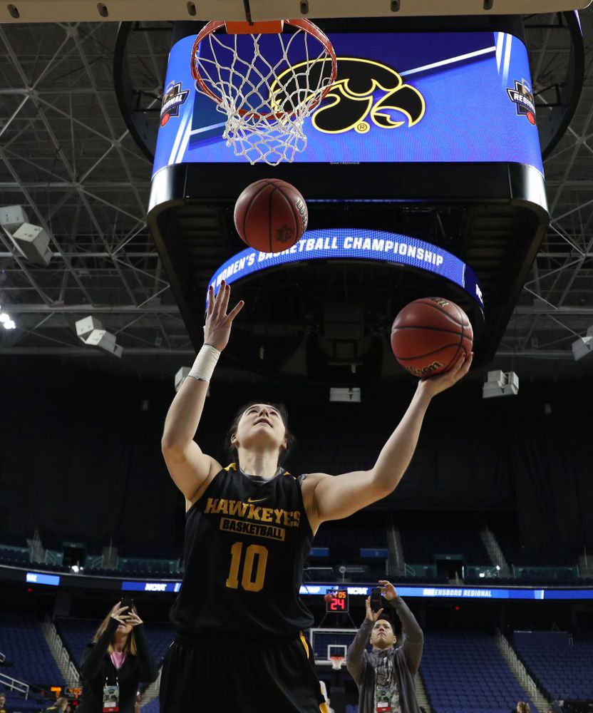 Iowa Hawkeyes forward Megan Gustafson (10) does the Mikan Drill the ESPN Crew following practice for their Sweet 16 matchup against NC State Friday, March 29, 2019 at the Greensboro Coliseum in Greensboro, NC.(Brian Ray/hawkeyesports.com)
