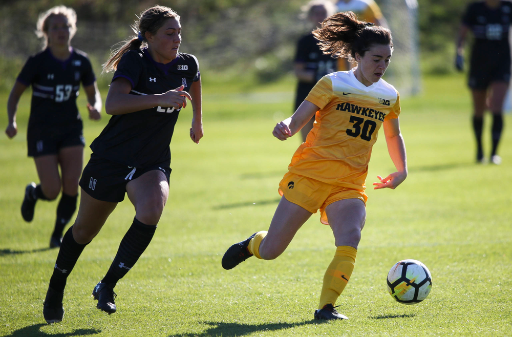 Iowa Hawkeyes forward Devin Burns (30) dribbles the ball during a game against Northwestern at the Iowa Soccer Complex on October 21, 2018. (Tork Mason/hawkeyesports.com)