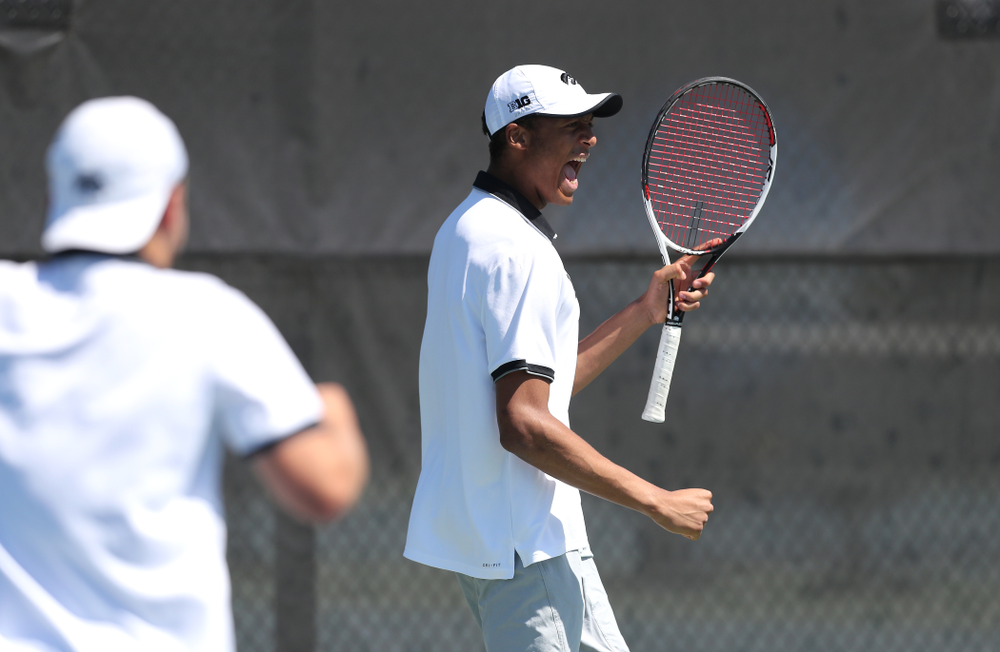 IowaÕs Oliver Okonkwo and Will Davies play a doubles match against the Michigan Wolverines Sunday, April 21, 2019 at the Hawkeye Tennis and Recreation Complex. (Brian Ray/hawkeyesports.com)