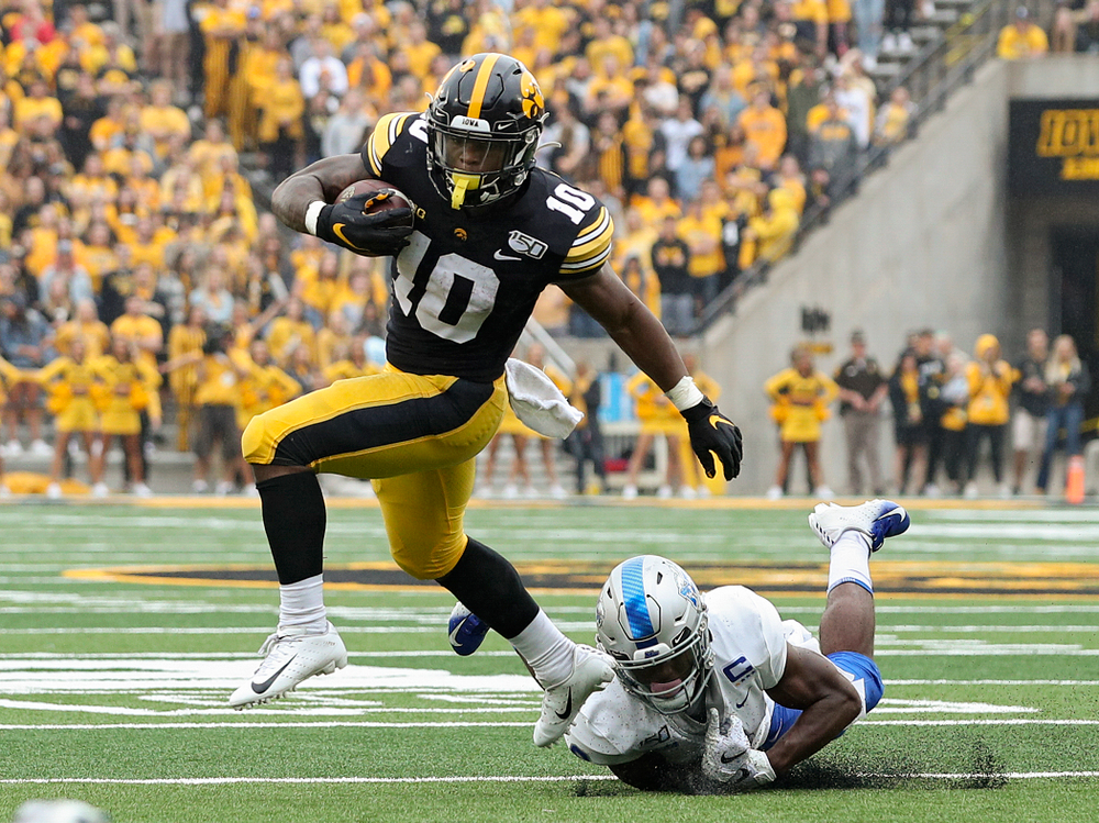 Iowa Hawkeyes running back Mekhi Sargent (10) pulls away from a tackle during the second quarter of their game at Kinnick Stadium in Iowa City on Saturday, Sep 28, 2019. (Stephen Mally/hawkeyesports.com)