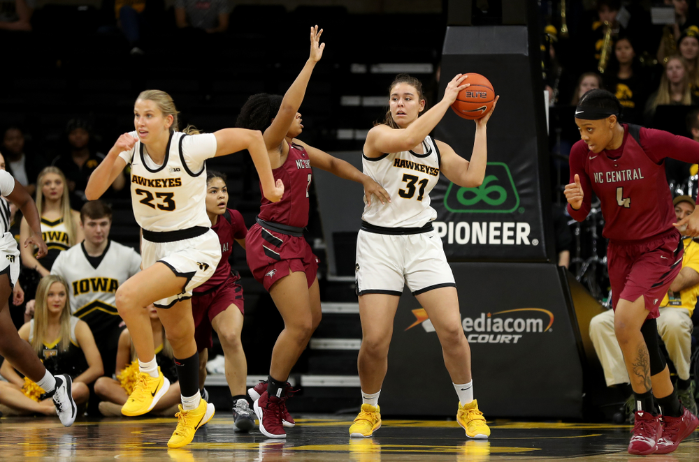 Iowa Hawkeyes forward/center Paula Vali?o Ramos (31) grabs a rebound against North Carolina Central Saturday, December 14, 2019 at Carver-Hawkeye Arena. (Brian Ray/hawkeyesports.com)