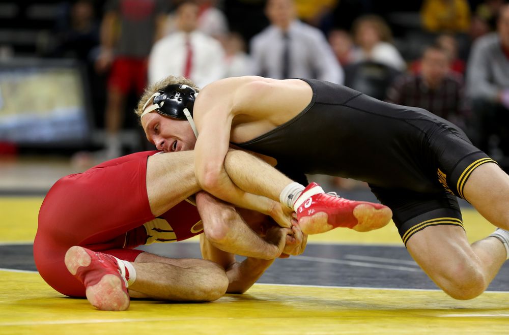 IowaÕs Kaleb Young wrestles WisconsinÕs Garrett Model at 157 pounds Sunday, December 1, 2019 at Carver-Hawkeye Arena. Young won the match 12-6. (Brian Ray/hawkeyesports.com)
