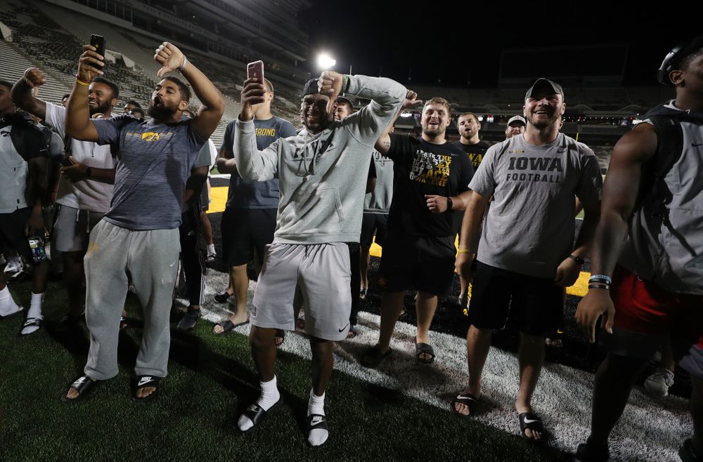 Members o the Iowa Football Team are not impressed by the new players first rendition of the ÒFight SongÓ Thursday, August 22, 2019 at Kinnick Stadium in Iowa City. (Brian Ray/hawkeyesports.com)