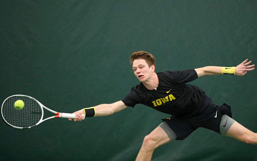 Iowa’s Jason Kerst hits a shot during his match against Marquette at the Hawkeye Tennis and Recreation Complex in Iowa City on Saturday, January 25, 2020. (Stephen Mally/hawkeyesports.com)
