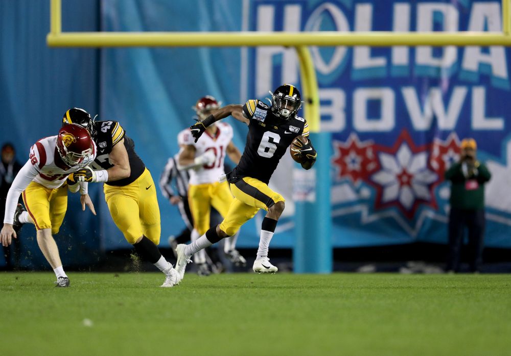 Iowa Hawkeyes wide receiver Ihmir Smith-Marsette (6) returns a kick for a touchdown against USC in the Holiday Bowl Friday, December 27, 2019 at San Diego Community Credit Union Stadium. (Brian Ray/hawkeyesports.com)