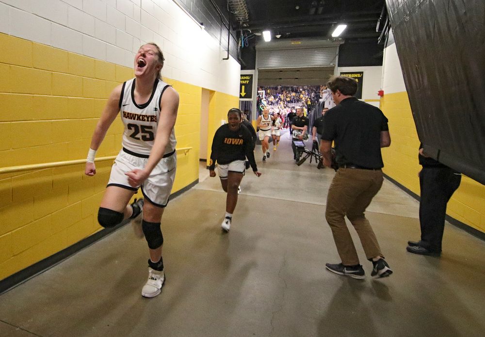 Iowa Hawkeyes forward Monika Czinano (25) celebrates as she runs back to the locker room after their double overtime win at Carver-Hawkeye Arena in Iowa City on Sunday, January 12, 2020. (Stephen Mally/hawkeyesports.com)