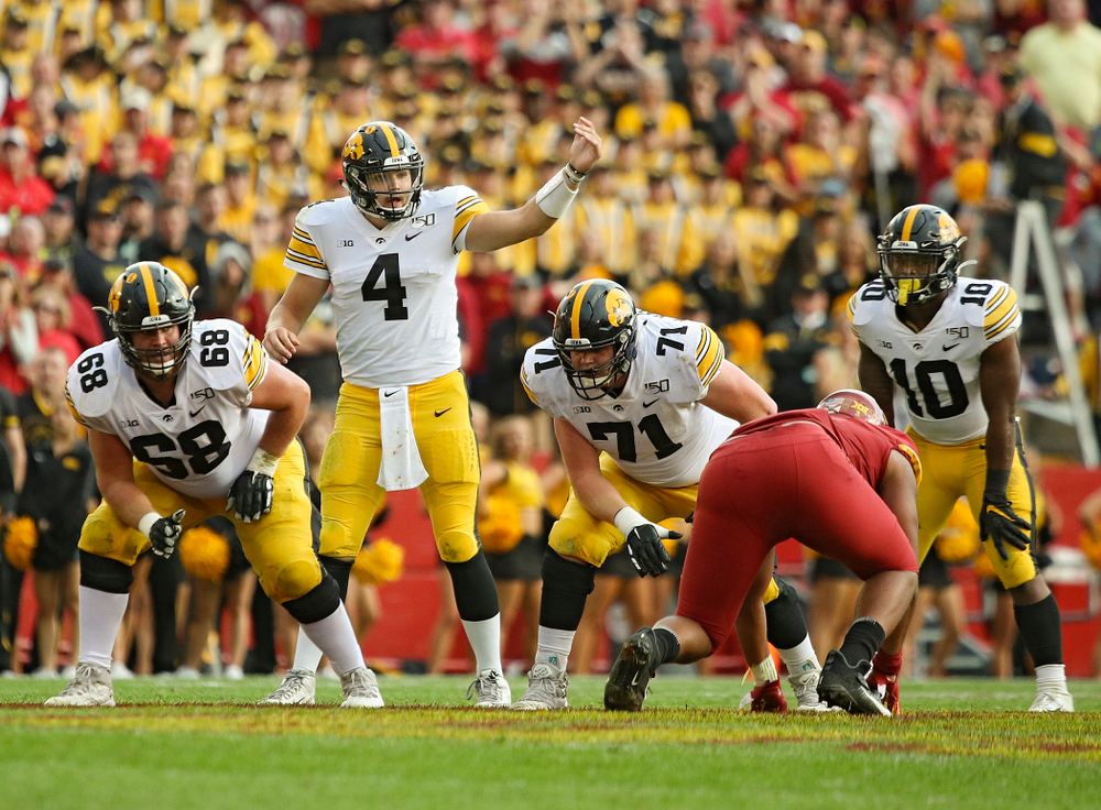 Iowa Hawkeyes quarterback Nate Stanley (4) motions at the line during the second quarter of their Iowa Corn Cy-Hawk Series game at Jack Trice Stadium in Ames on Saturday, Sep 14, 2019. (Stephen Mally/hawkeyesports.com)