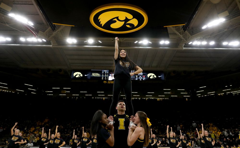 The Iowa Spirit Squad performs with participants in Spirit Squad Day at halftime of the Iowa Hawkeyes game against the Nebraska Cornhuskers Saturday, February 8, 2020 at Carver-Hawkeye Arena. (Brian Ray/hawkeyesports.com)