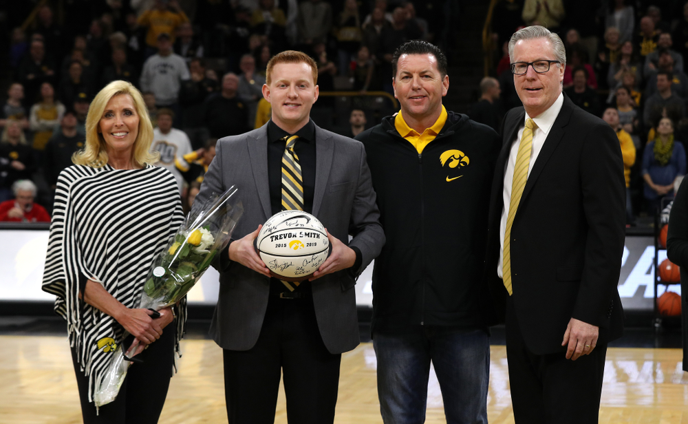 Senior Manager Trevor Smith stands with Iowa Hawkeyes head coach Fran McCaffery and his family during senior day activities before their game against the Rutgers Scarlet Knights Saturday, March 2, 2019 at Carver-Hawkeye Arena. (Brian Ray/hawkeyesports.com)