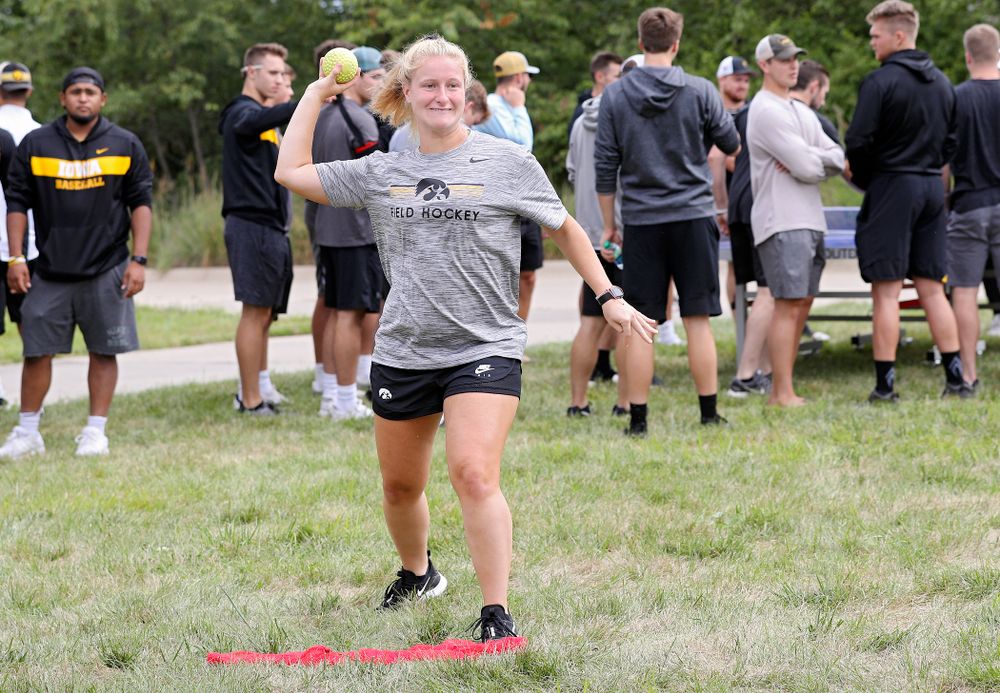 Iowa Field Hockey’s Ryley Miller tries to sink Swimming head coach Marc Long in the dunk tank during the Student-Athlete Kickoff outside the Karro Athletics Hall of Fame Building in Iowa City on Sunday, Aug 25, 2019. (Stephen Mally/hawkeyesports.com)