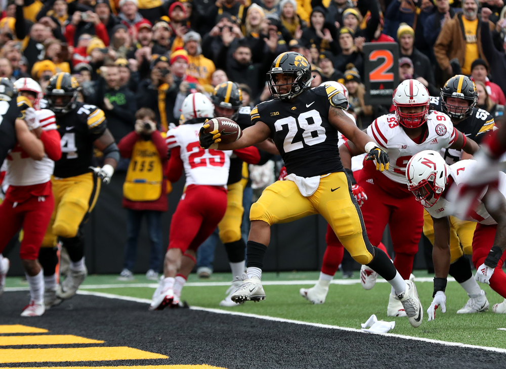 Iowa Hawkeyes running back Toren Young (28) scores against the Nebraska Cornhuskers Friday, November 23, 2018 at Kinnick Stadium. (Brian Ray/hawkeyesports.com)