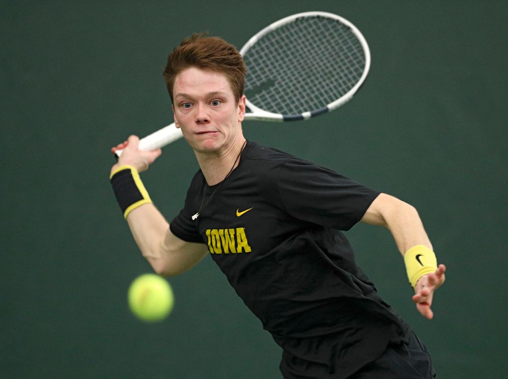 Iowa’s Jason Kerst hits a shot during his match against Marquette at the Hawkeye Tennis and Recreation Complex in Iowa City on Saturday, January 25, 2020. (Stephen Mally/hawkeyesports.com)