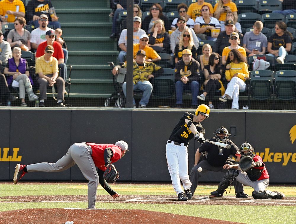 Iowa Hawkeyes right fielder Connor McCaffery (30) drives a pitch for a hit during the seventh inning of their game against Rutgers at Duane Banks Field in Iowa City on Saturday, Apr. 6, 2019. (Stephen Mally/hawkeyesports.com)