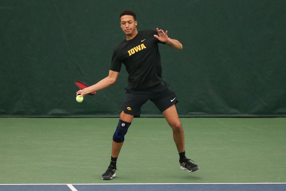 Iowa’s Oliver Okonkwo returns a hit during the Iowa men’s tennis meet vs VCU on Saturday, February 29, 2020 at the Hawkeye Tennis and Recreation Complex. (Lily Smith/hawkeyesports.com)