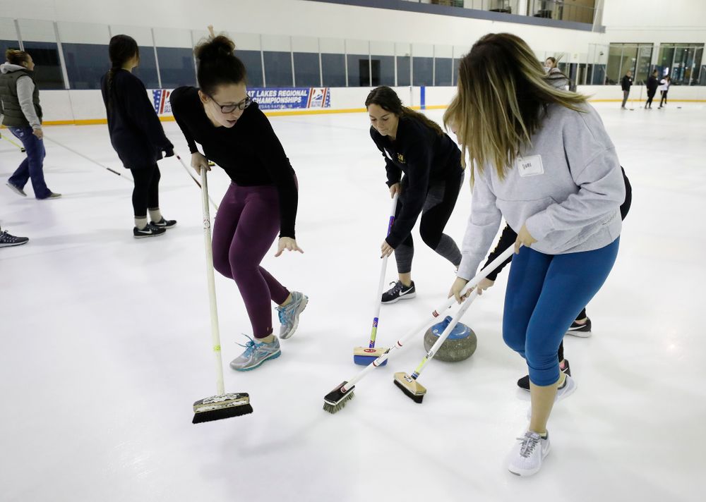 Members of the Iowa Softball team learn the sport of curling as part of a team building event Wednesday, January 10, 2018 at the Cedar Rapids Ice Arena. (Brian Ray/hawkeyesports.com)