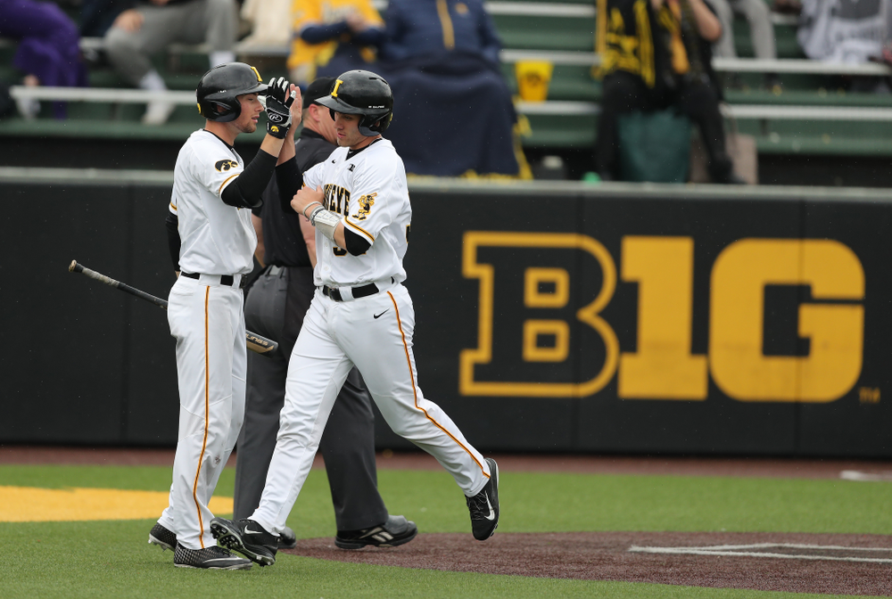 Iowa Hawkeyes catcher Austin Martin (34) and outfielder Ben Norman (9) against Michigan State Sunday, May 12, 2019 at Duane Banks Field. (Brian Ray/hawkeyesports.com)