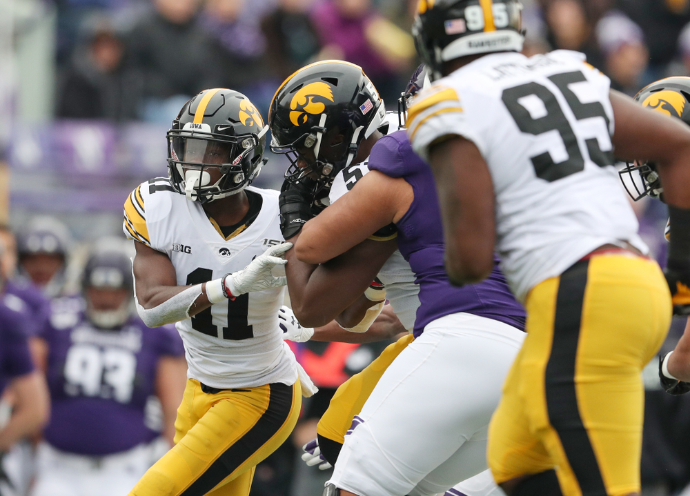 Iowa Hawkeyes defensive end Chauncey Golston (57) intercepts a pass against the Northwestern Wildcats Saturday, October 26, 2019 at Ryan Field in Evanston, Ill. (Brian Ray/hawkeyesports.com)