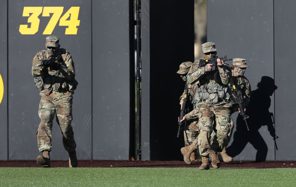 Members of the University of Iowa ROTC deliver the game ball before the Iowa Hawkeyes game against the Nebraska Cornhuskers on Military Appreciation Night Friday, April 19, 2019 at Duane Banks Field. (Brian Ray/hawkeyesports.com)