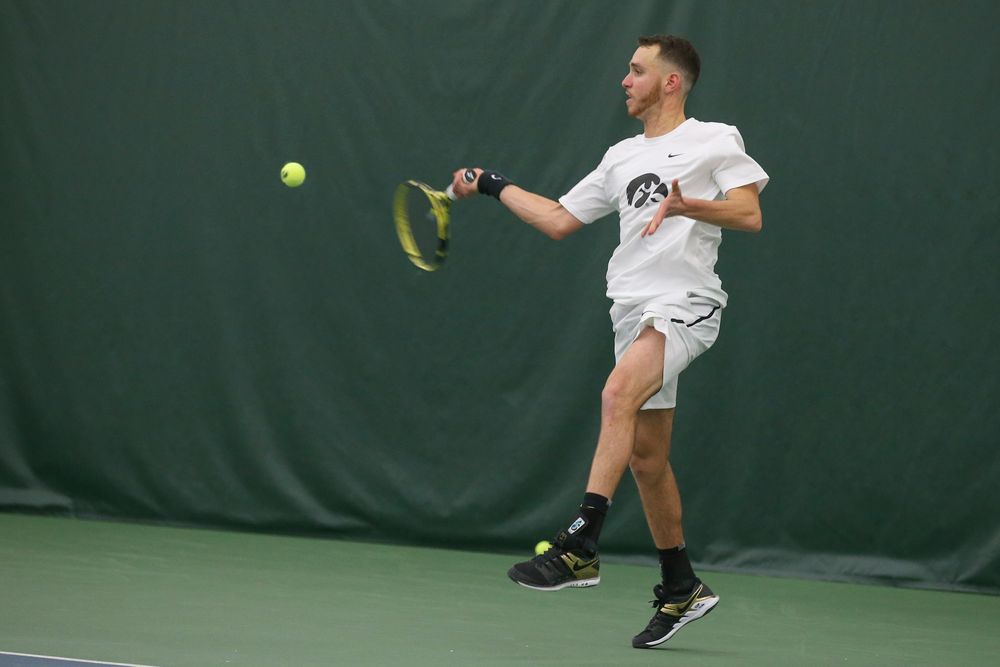 Iowa’s Kareem Allaf returns a hit during the Iowa men’s tennis meet vs Nebraska on Sunday, March 1, 2020 at the Hawkeye Tennis and Recreation Complex. (Lily Smith/hawkeyesports.com)