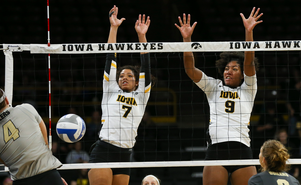 Iowa Hawkeyes setter Brie Orr (7) and Iowa Hawkeyes middle blocker Amiya Jones (9) block an attack during a game against Purdue at Carver-Hawkeye Arena on October 13, 2018. (Tork Mason/hawkeyesports.com)