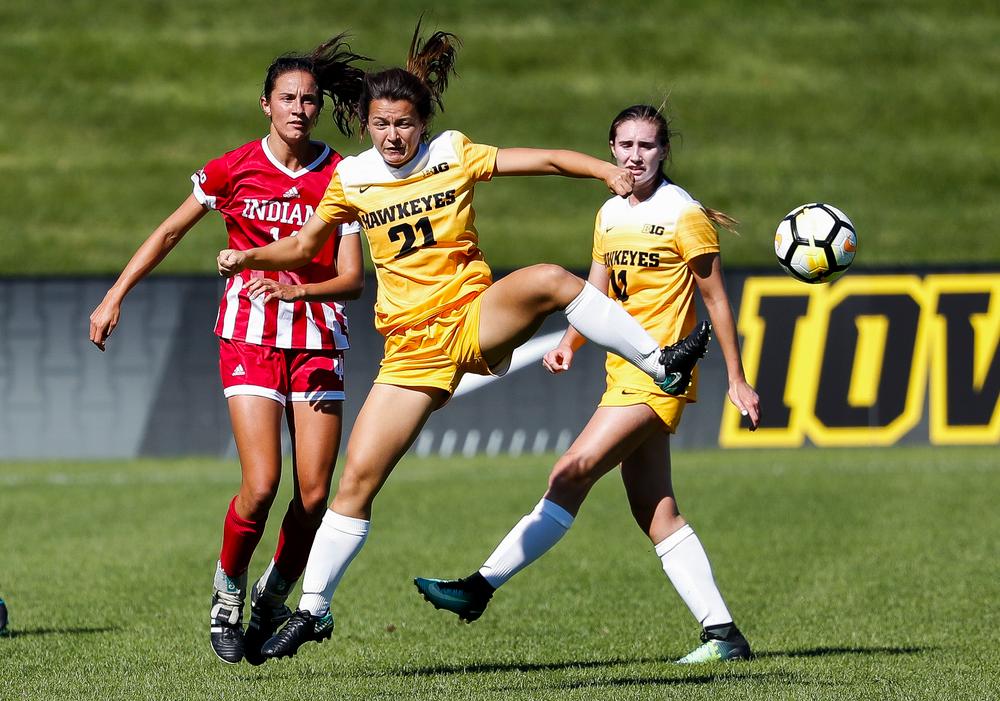 Iowa Hawkeyes forward Emma Tokuyama (21) heads the ball during a game against Indiana at the Iowa Soccer Complex on September 23, 2018. (Tork Mason/hawkeyesports.com)