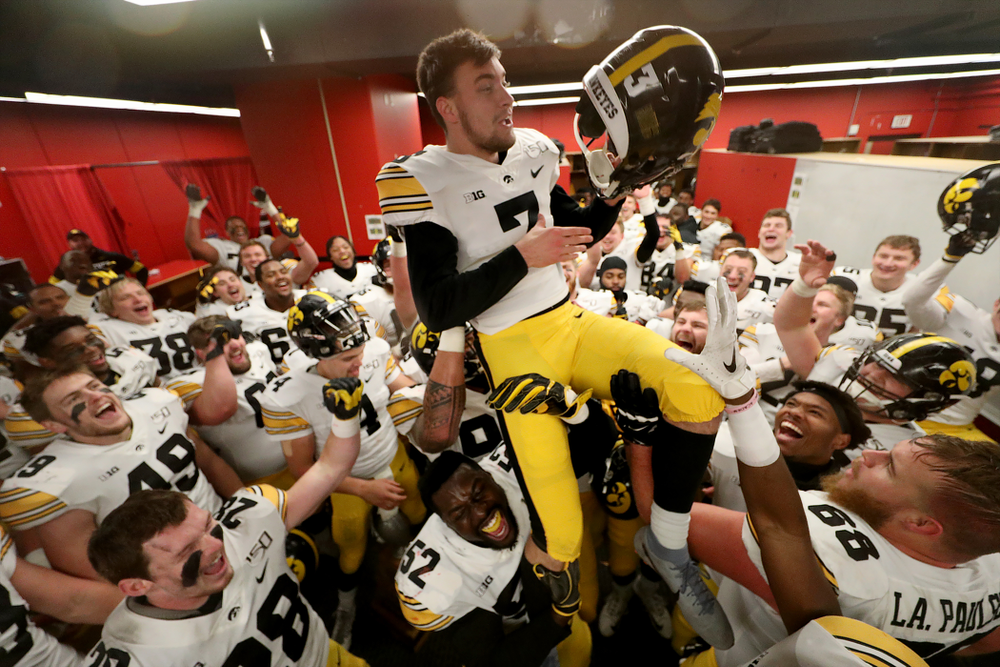 The Iowa Hawkeyes hoist up place kicker Keith Duncan (3) as they celebrate their victory against the Nebraska Cornhuskers Friday, November 29, 2019 at Memorial Stadium in Lincoln, Neb. (Brian Ray/hawkeyesports.com)