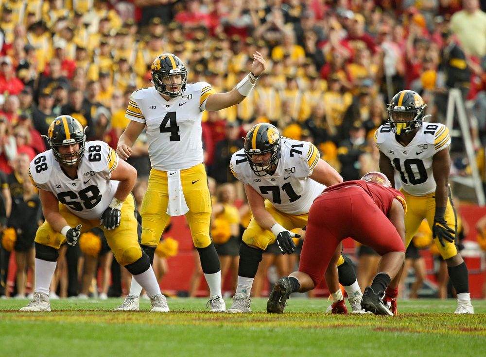 Iowa Hawkeyes quarterback Nate Stanley (4) motions at the line during the second quarter of their Iowa Corn Cy-Hawk Series game at Jack Trice Stadium in Ames on Saturday, Sep 14, 2019. (Stephen Mally/hawkeyesports.com)