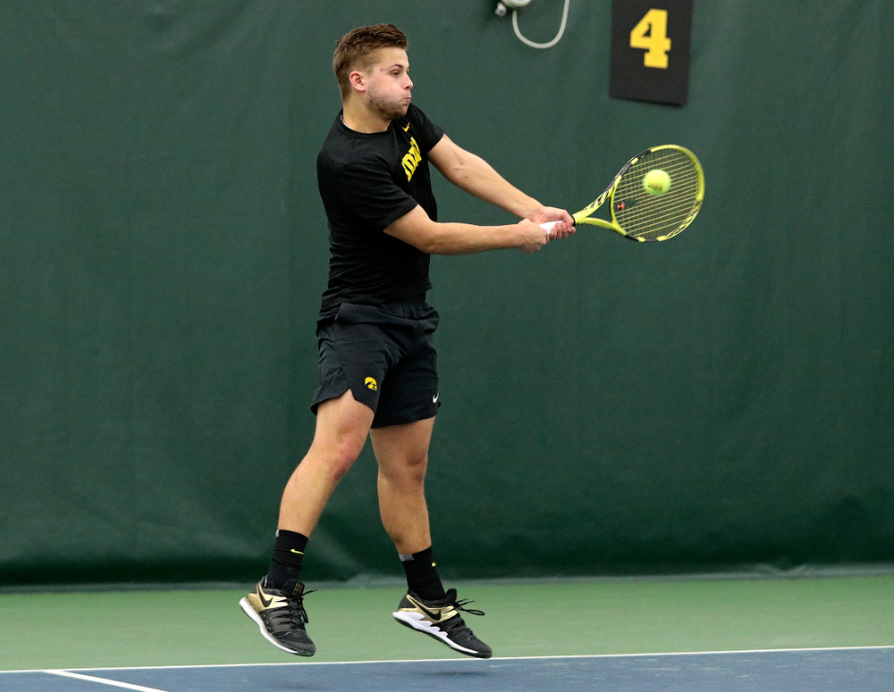 Iowa’s Will Davies returns a shot during his singles match at the Hawkeye Tennis and Recreation Complex in Iowa City on Friday, February 14, 2020. (Stephen Mally/hawkeyesports.com)