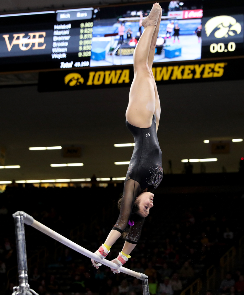 Iowa’s Carina Tolan competes on the bars against Michigan Friday, February 14, 2020 at Carver-Hawkeye Arena. (Brian Ray/hawkeyesports.com)