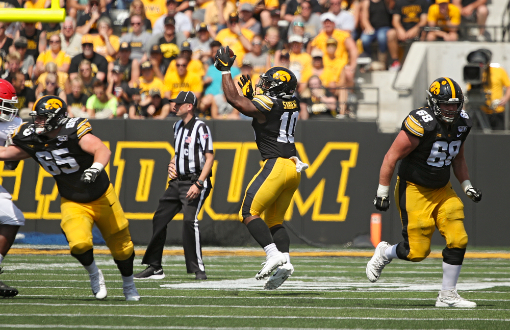 Iowa Hawkeyes running back Mekhi Sargent (10) pulls in a pass with one hand during the third quarter of their Big Ten Conference football game at Kinnick Stadium in Iowa City on Saturday, Sep 7, 2019. (Stephen Mally/hawkeyesports.com)