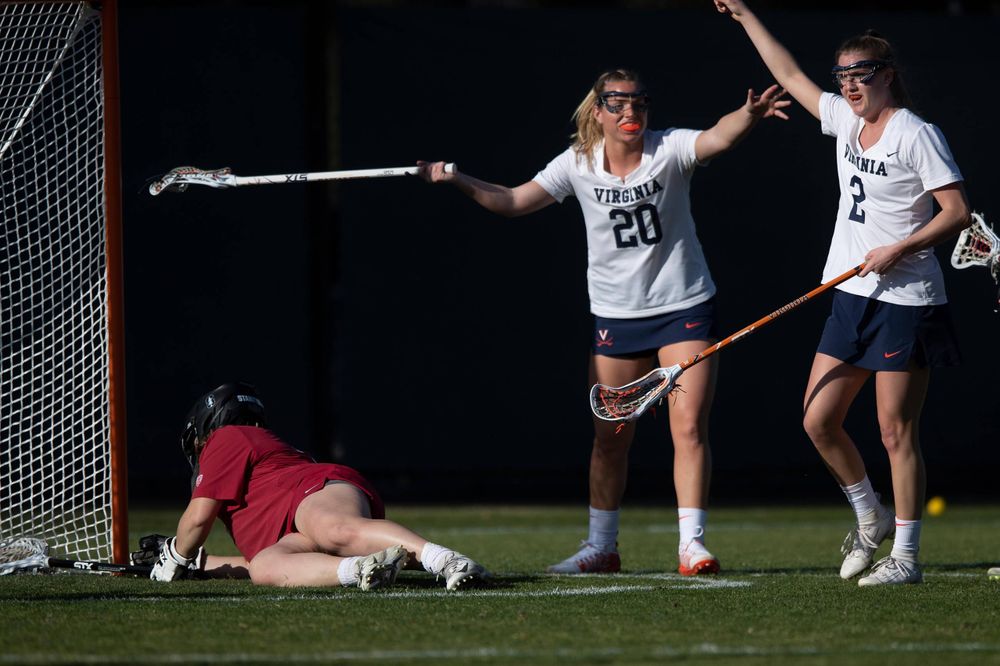 STANFORD, California - FEBRUARY 14: Virginia Cavaliers midfield Sammy Mueller (2) celebrates with midfield Lillie Kloak (20) after scoring a goal past Stanford Cardinal goalkeeper Trudie Grattan (3) during the first half at Cagan Stadium on February 14, 2020 in Stanford, California. The Virginia Cavaliers defeated the Stanford Cardinal 12-11. (Photo by Jason O. Watson)