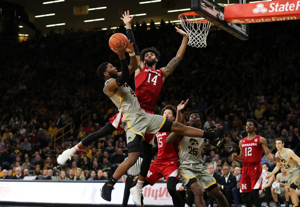 Iowa Hawkeyes guard Isaiah Moss (4) is fouled as he goes to the hoop against the Nebraska Cornhuskers Sunday, January 6, 2019 at Carver-Hawkeye Arena. (Brian Ray/hawkeyesports.com)