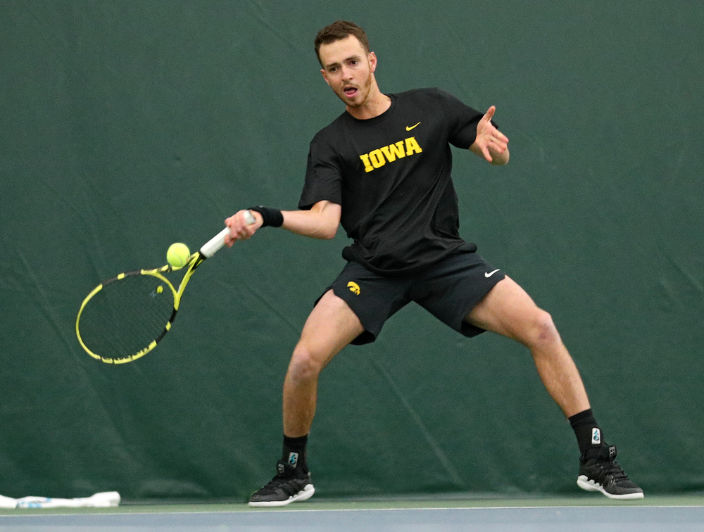 Iowa’s Kareem Allaf hits a shot during his match against Marquette at the Hawkeye Tennis and Recreation Complex in Iowa City on Saturday, January 25, 2020. (Stephen Mally/hawkeyesports.com)